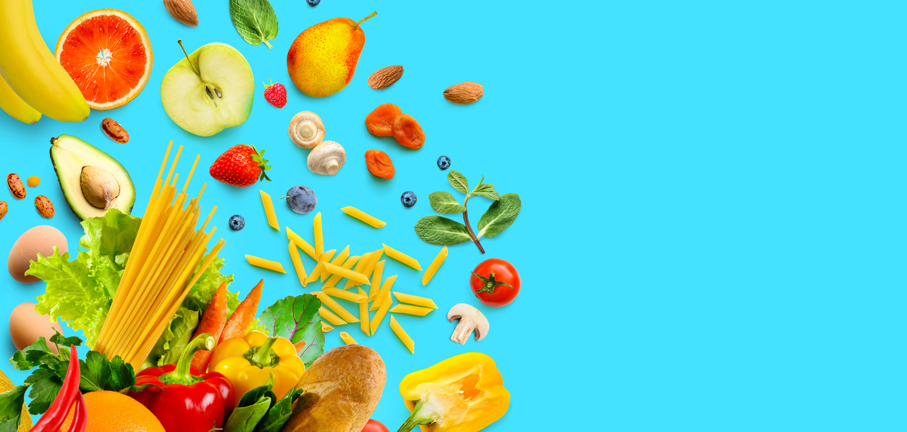 Healthy food assortment. Vegetables and fruits, groceries on aqua blue background. Copy space